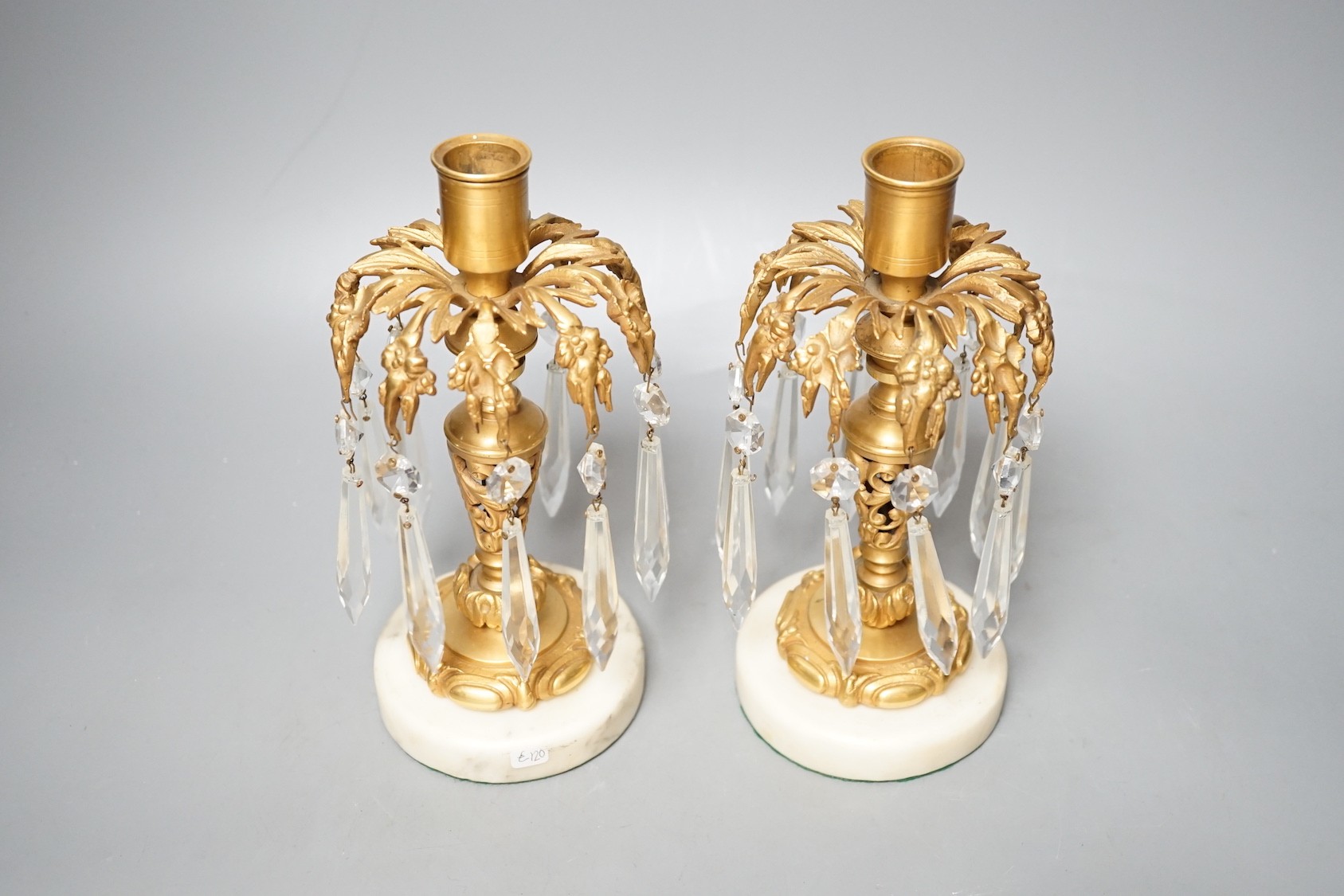 A pair of gilt metal and glass lustre drop candlesticks - 22cm tall
